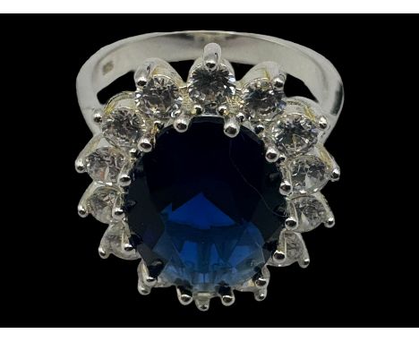 Silver blue stone and cubic zirconia cluster ring, boxedCondition Report:Size R