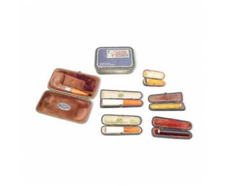 Amber gold mounted cheroot holder, 12.5 ct hallmarked, cased, together with another gold mounted example and various others, 