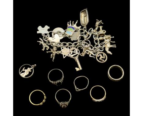 Two 9ct gold rings, including garnet cluster ring, silver charm bracelet and silver rings and costume jewelleryCondition Repo