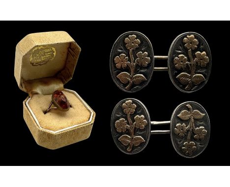 8ct gold Baltic amber ring, stamped 333 and a pair of silver and gold cufflinks, hallmarkedCondition Report:8ct approx 1.7 gr