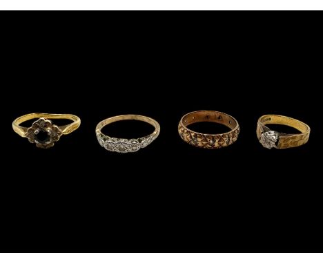 Two 18ct gold rings, including diamond ring and stone set cluster ring, together with two 9ct gold stone set rings, all stamp