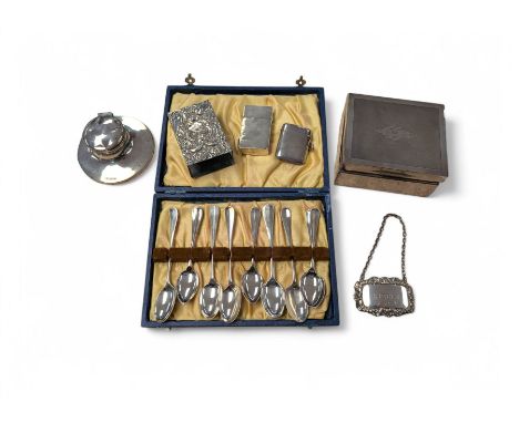 Group of silver, including silver mounted inkwell, teaspoons, cigarette box, vesta case, match box holder, lighter and decant