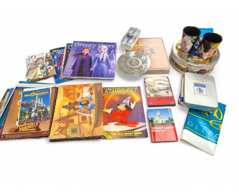 Collection of Disney memorabilia and ephemera, including Walt Disney Treasures DVD, two Disney Villains mugs, enamel pins, Mi