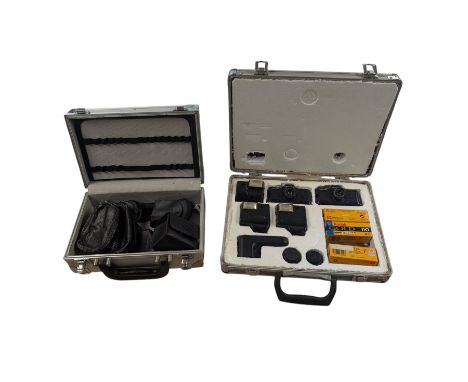 Two Pentax Auto 110 camera bodies and accessories including flashes, winder and lenses, all within two flight cases
