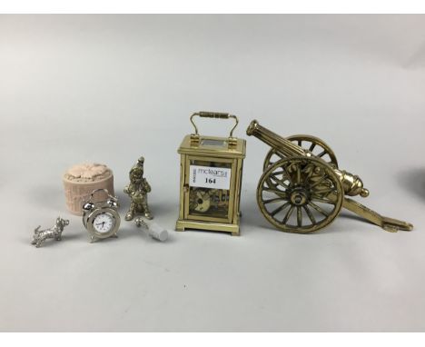 BRASS CARRIAGE CLOCK, along with other items including a brass canon, wine slides and various trinket boxes