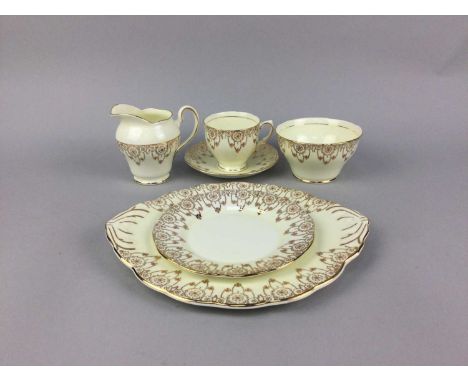 SALISBURY TEA SERVICE, with gilt decoration on a cream ground, comprising six trios, cream, sugar and sandwich plate