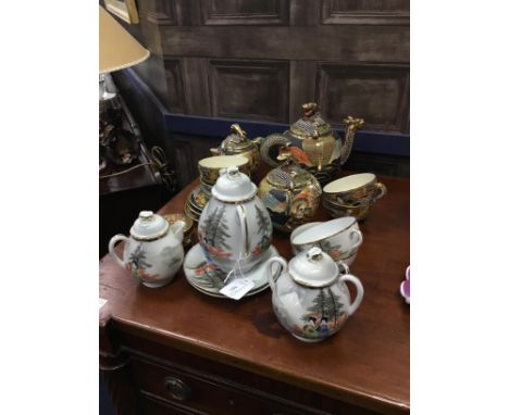 JAPANESE EGGSHELL TWO PERSON TEA SERVICE, with figural decoration, along with a part tea service with dragon and figural deco