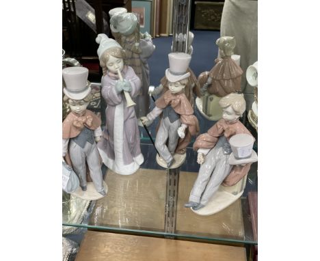 LLADRO FIGURE OF A GIRL PLAYING A HORN, along with three other Lladro figures of boys in vintage dress (4)