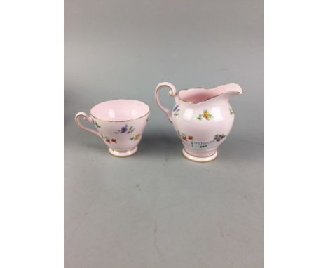 TUSCAN FLORAL DECORATED TEA SERVICE, with colourful floral decoration on a pale pink ground, comprising twelve trios, cream, 