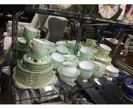 TUSCAN PART TEA SERVICE, with gilt decoration on a green ground, along with a Staffordshire 'Coronet' part tea service