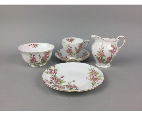 TUSCAN 'SPRINGTIME' PATTERN TEA SERVICE, decorated with foliage and pink flowerheads on a cream ground, with gilt edging, com