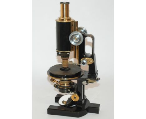 A LAQUERED BRASS AND BLACK ENAMEL JUG-HANDLE CARL ZEISS JENA MICROSCOPE No.31373, 35cm high,  in fitted case with additional 