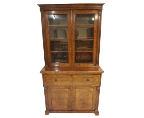 A VICTORIAN BURR WALNUT SECRETAIRE BOOKCASE with a pair of glazed doors enclosing shelves, the base section with hinged drawe