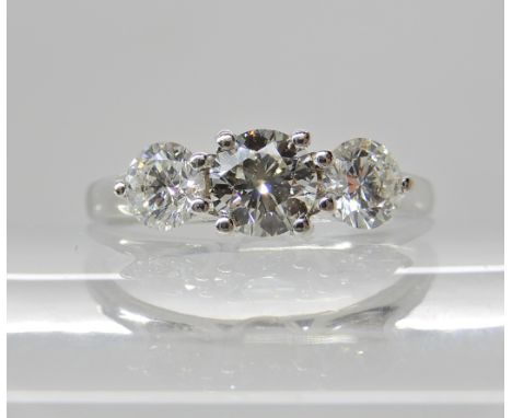 A THREE STONE DIAMOND RING of estimated approx 1ct combined, finger size O, weight 3.3gms Condition Report: Diamonds estimate