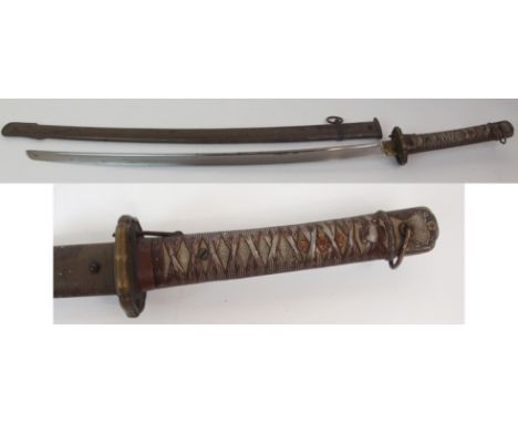 A WWII JAPANESE NCO'S SWORD the cast metal hilt with a pair of Menuki and the arsenal markings, the 69.5cm long curved fuller