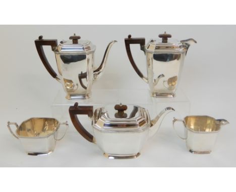 A MATCHED FIVE PIECE SILVER TEA AND COFFEE SERVICE by Mappin &amp; Webb, Sheffield 1961, of tapering rectangular form with ca