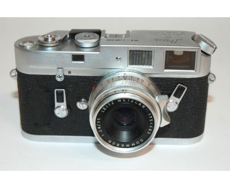 A LEICA M4-1188 909 RANGEFINDER CAMERA in leather case, with additional lenses, instructions, Leica meter etc Condition Repor