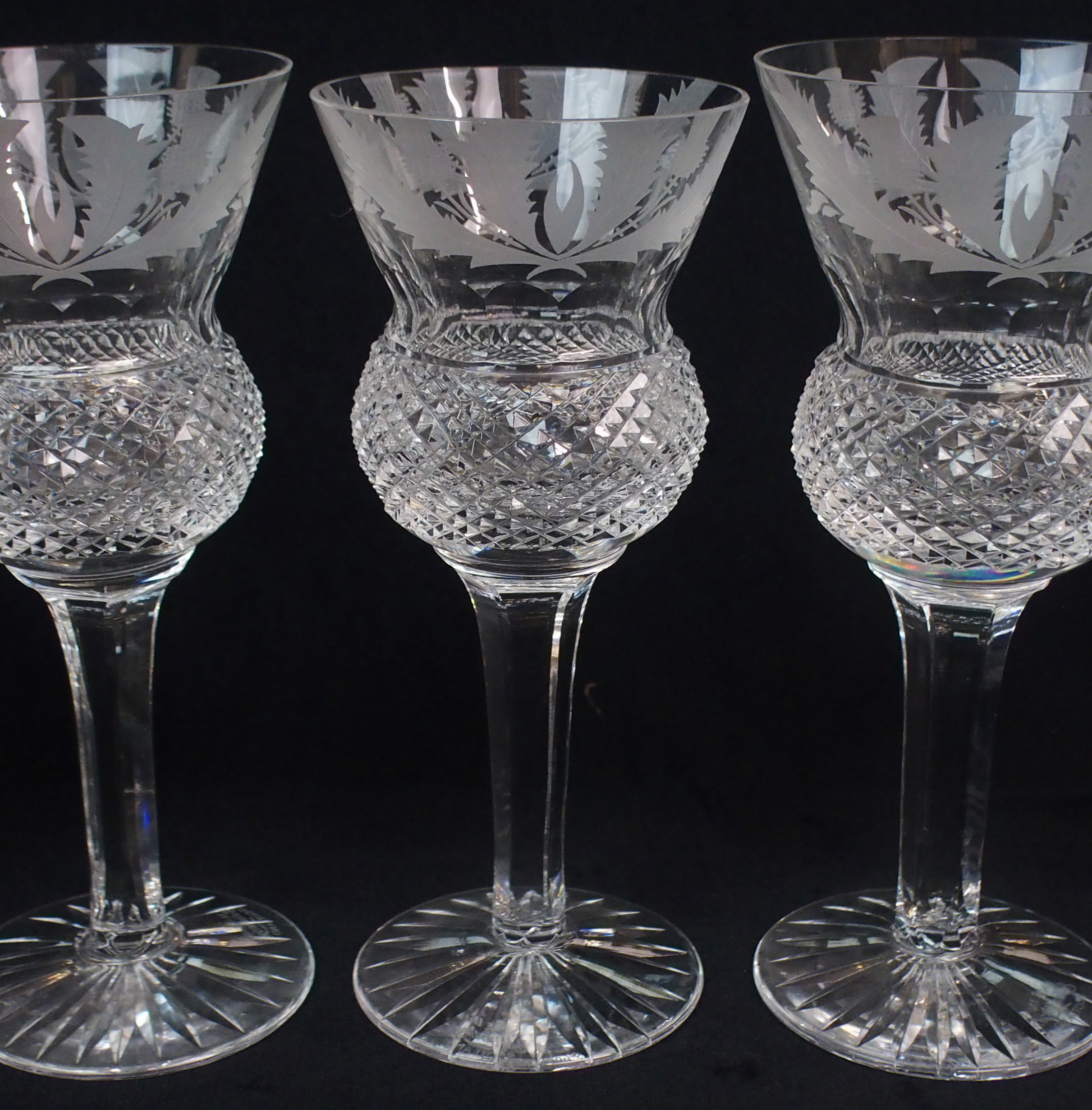 AN EXTENSIVE COLLECTION OF EDINBURGH CRYSTAL THISTLE SHAPED DRINKING