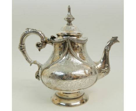 A VICTORIAN SILVER TEAPOT by Joseph Angel II, London 1853, of pear shape with geometric and foliate engraved decoration, scro