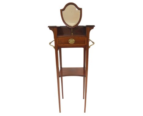 AN EDWARDIAN MAHOGANY AND SATINWOOD BANDED WASH STAND with shield shaped mirror above a drawer flanked by a pair of brass tow