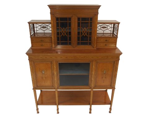 AN EDWARDIAN SATINWOOD AND MARQUETRY INLAID DISPLAY CABINET with a pair of central glazed doors flanked by two pairs of drawe