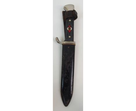 A HITLER YOUTH DAGGER with Bakelite hilt, enamelled Swastika emblem and plated mounts, the 13.5cm long blade inscribed "Blut 