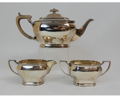 A THREE PIECE SILVER TEA SERVICE by Cooper Brothers &amp; Sons Limited, Sheffield 1966, of rectangular form with canted corne