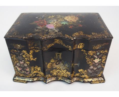 A VICTORIAN LACQUERED PAPIER MACHE TWO-DIVISION TEA CADDY with gilt and mother of pearl detailing, shaped serpentine front, 1