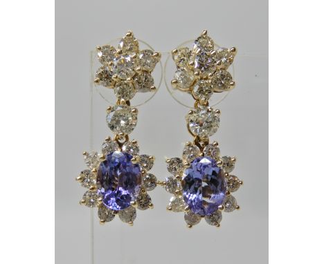 A PAIR OF BRIGHT YELLOW METAL DIAMOND AND SAPPHIRE DROP EARRINGS sapphires measure approx 8mm x 6mm x  5mm, diamond content f