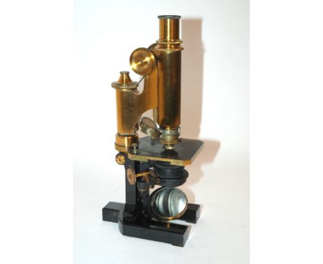 A LACQUERED BRASS AND BLACK ENAMEL CARL ZEISS JENA MICROSCOPE No.7973, 29cm high,  in fitted case with additional lenses Cond