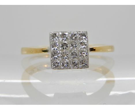 AN 18CT YELLOW GOLD PRINCESS CUT DIAMOND CLUSTER RING set with a block of sixteen princess cut diamonds with an estimated app