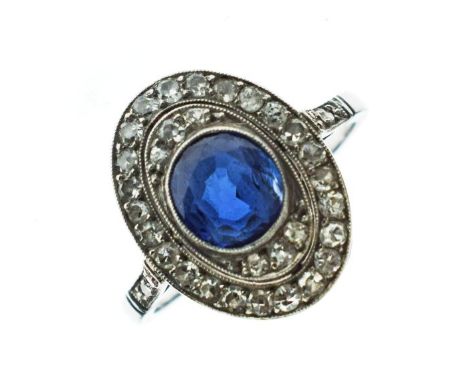 French sapphire and diamond panel ring, the oval cut stone enclosed by single cut diamonds, pairs of diamonds to each shoulde