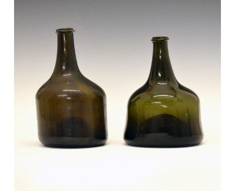 Two 18th Century green glass squat shaped wine bottles, 19cm and 20.5cm high  Condition: Both bottles have light surface scra