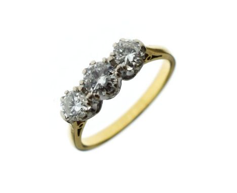 Three stone diamond ring, stamped '18ct', the graduated brilliant cuts totalling approximately 1 carat, size N½, 3.6g gross  