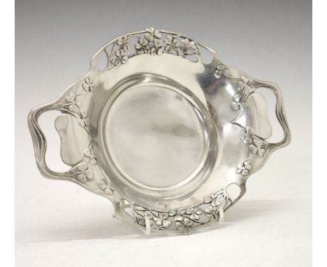 Liberty & Co Tudric circular two handled bowl, the pierced border decorated with clover leaves, the underside stamped Made in