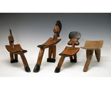 Ethnographica - Three Burkina Faso Lobi tripod stools, two having carved decoration depicting male heads, another decorated w