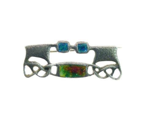 Archibald Knox for Liberty & Co - Silver and enamel brooch having a hammered finish, makers mark only, 39mm wide See Adrian J