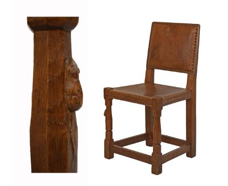 Robert 'Mouseman' Thompson of Kilburn - Oak side chair having a leather seat and back, the leg with typical carved mouse sign