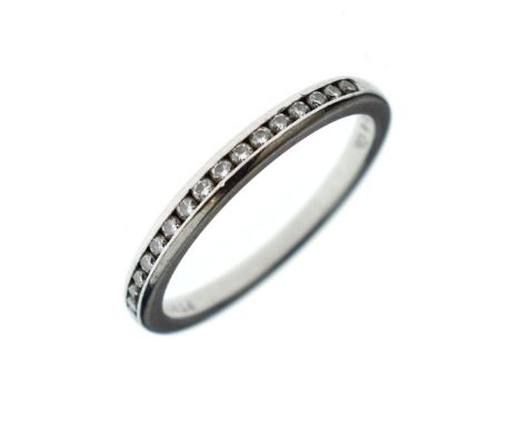 Tiffany & Co - Seventeen stone diamond half hoop ring, stamped makers name and 'Pt 950', the channel set brilliant cuts total