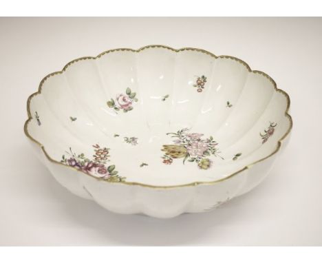 Large 18th Century Bristol porcelain fluted bowl having polychrome painted foliate decoration, marked with a blue X, 29cm dia