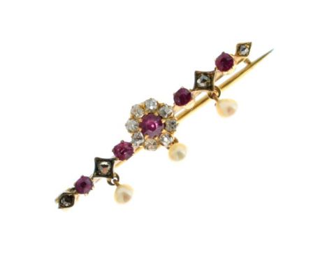 Diamond, ruby and pearl brooch, unmarked, circa 1900, the central ruby enclosed by eight small old brilliant cuts, with a lin