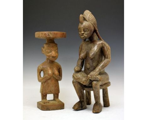 Ethnographica - West African carved stool in the form of a standing female figure, 44cm high, together with a carved figure i