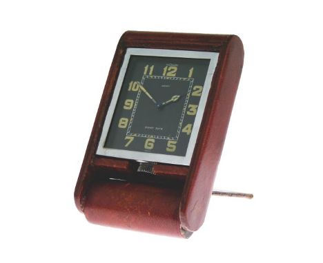 Le Coultre for Asprey - 1930's period travel clock in red Morocco mounted folding case, black dial signed Le Coultre and Aspr