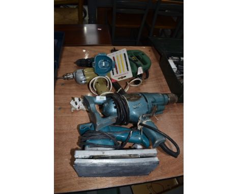 A selection of vintage electric hand tools including sander drill driver jigsaw etc