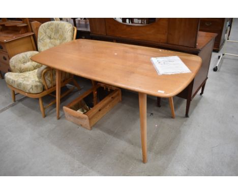 An Ercol light stain dining table, approx. 150 x 75cm, generally sound, a few light scratches and stains
