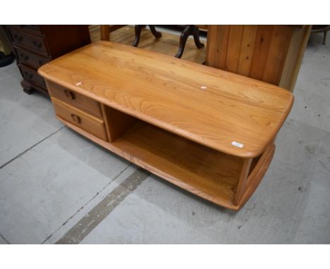 An Ercol coffee table, in the Minerva/Pandora style having double drawer base, dimensions approx. W125cm D54cm H40cm
