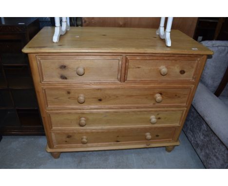 A modern natural pine chest of two over three drawers, width approx. 107cm, beading missing off bottom drawer, few light mark
