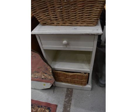 A painted bathroom shelf with underbasket