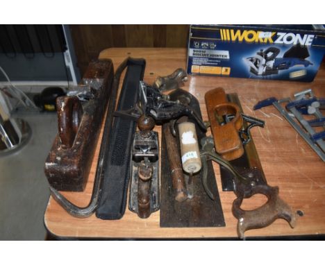 A selection of wood working tools including hand plane Spear and Jackson saw and large float