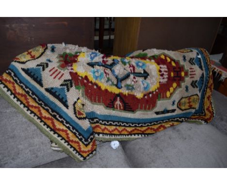A vintage pegged style rug